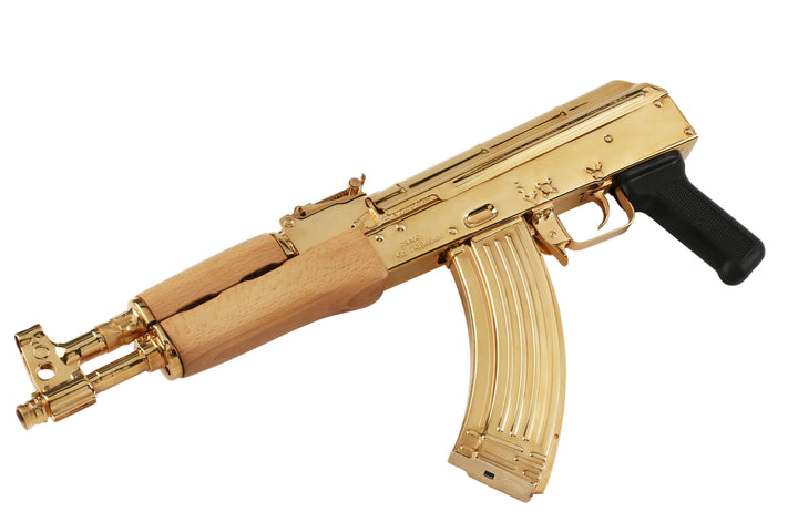 24K Gold Plated Century Arms Draco, high polished to a mirror finish. The Century Arms Draco wraps the AK style into the pistol format. Chambered in 7.62x39mm this semi-automatic pistol has a 12" barrel. While it comes standard with a 30-round magazine the Century Arms Draco is compatible with any AK double stack magazine or drum. The barrel includes an integral front sight and gas tube. SKU: 7783559135334 MFG MODEL NO: HG1916N UPC: 787450044357 DESCRIPTION: Century Arms HG1916N BRAND: Century Arms MODEL: D