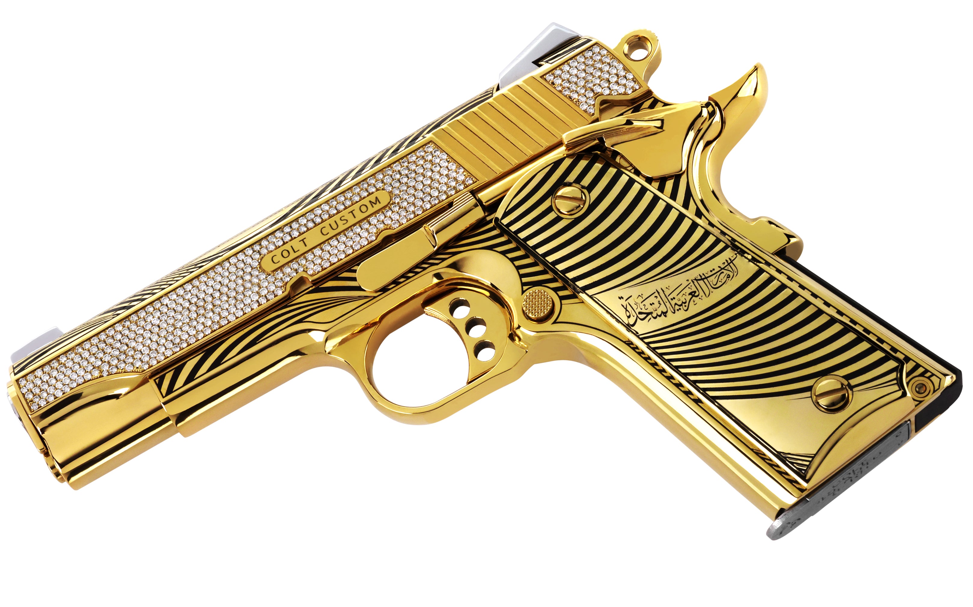 Close-up of VS1 G-color diamond setting along the slide of the Colt Commander Crown of the Moon luxury pistol in high-polish 24K Italian Gold.