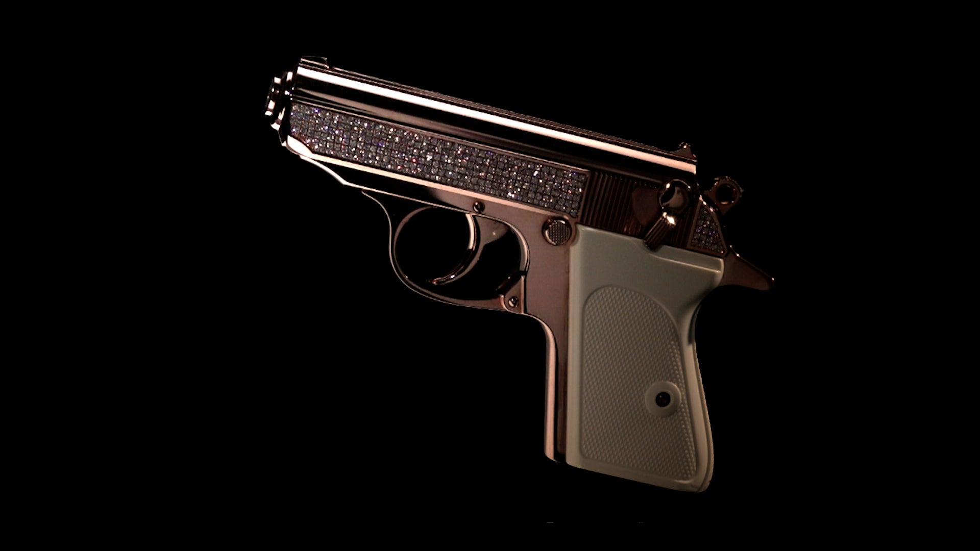 Diamond arrangement and surface detail along the slide of the Walther PPK Oasis Edition in 18K Rose Gold,UPC # 723364209932